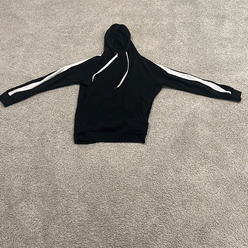 Large plain and simple black hoodie with white strips on sleeves
